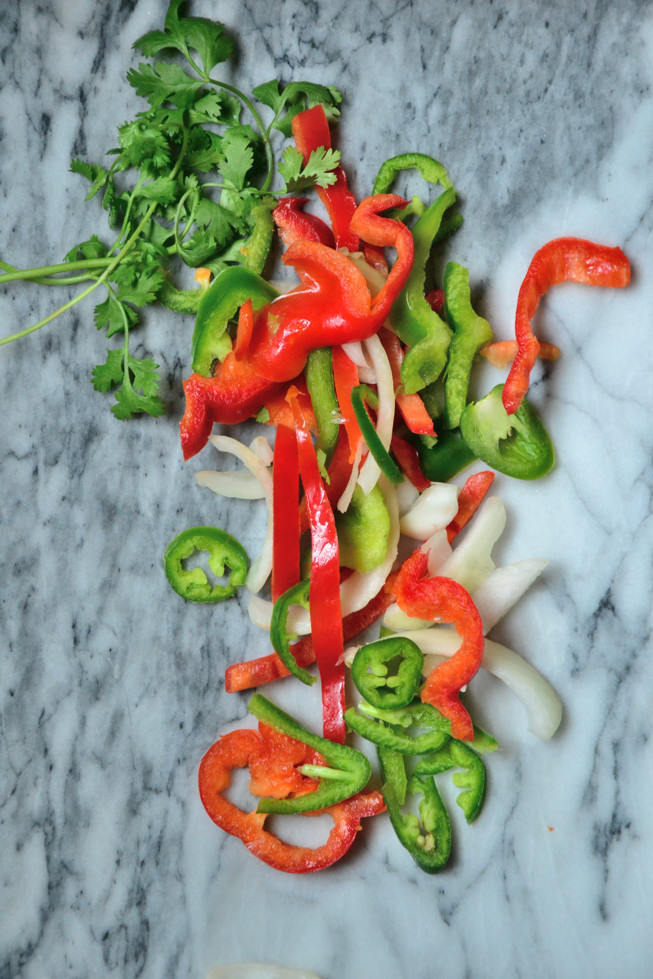 Sliced red and green bell peppers with jalapenos and white onions ready to be sauted for Grain-Free Easy Tortillas.