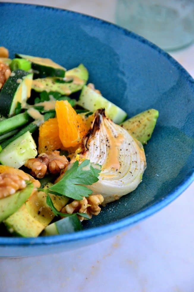 This French Green Bean Salad is loaded with flavor bursting with oranges, cucumbers, roasted onions and more in a beautiful blue bowl.